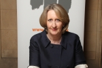 Mary signs HET's Book of Commitment