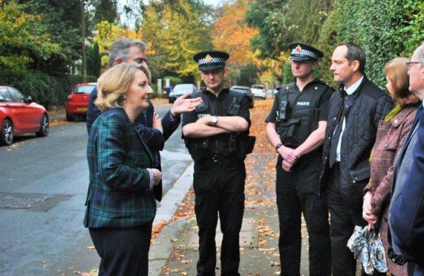 Mary Robinson pictured with Brandon Lewis and police officers.