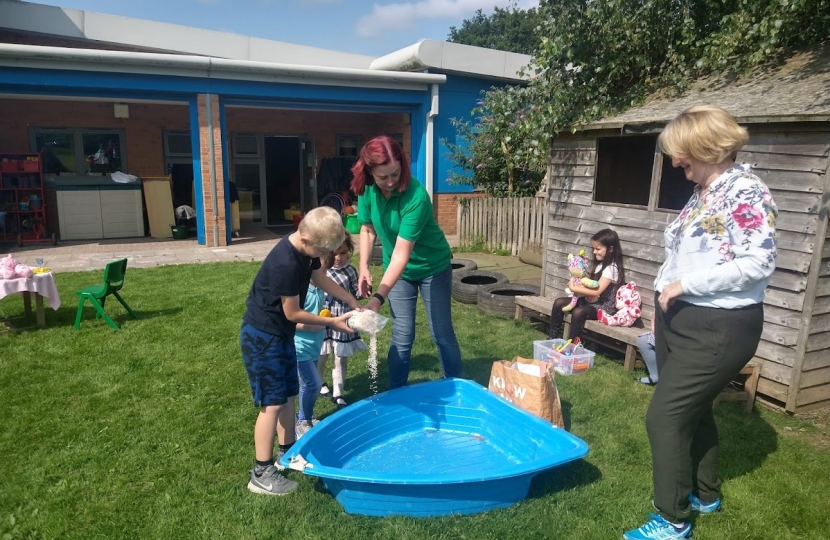 Mary interacting and making Slime with the children of Playclub Unlimited